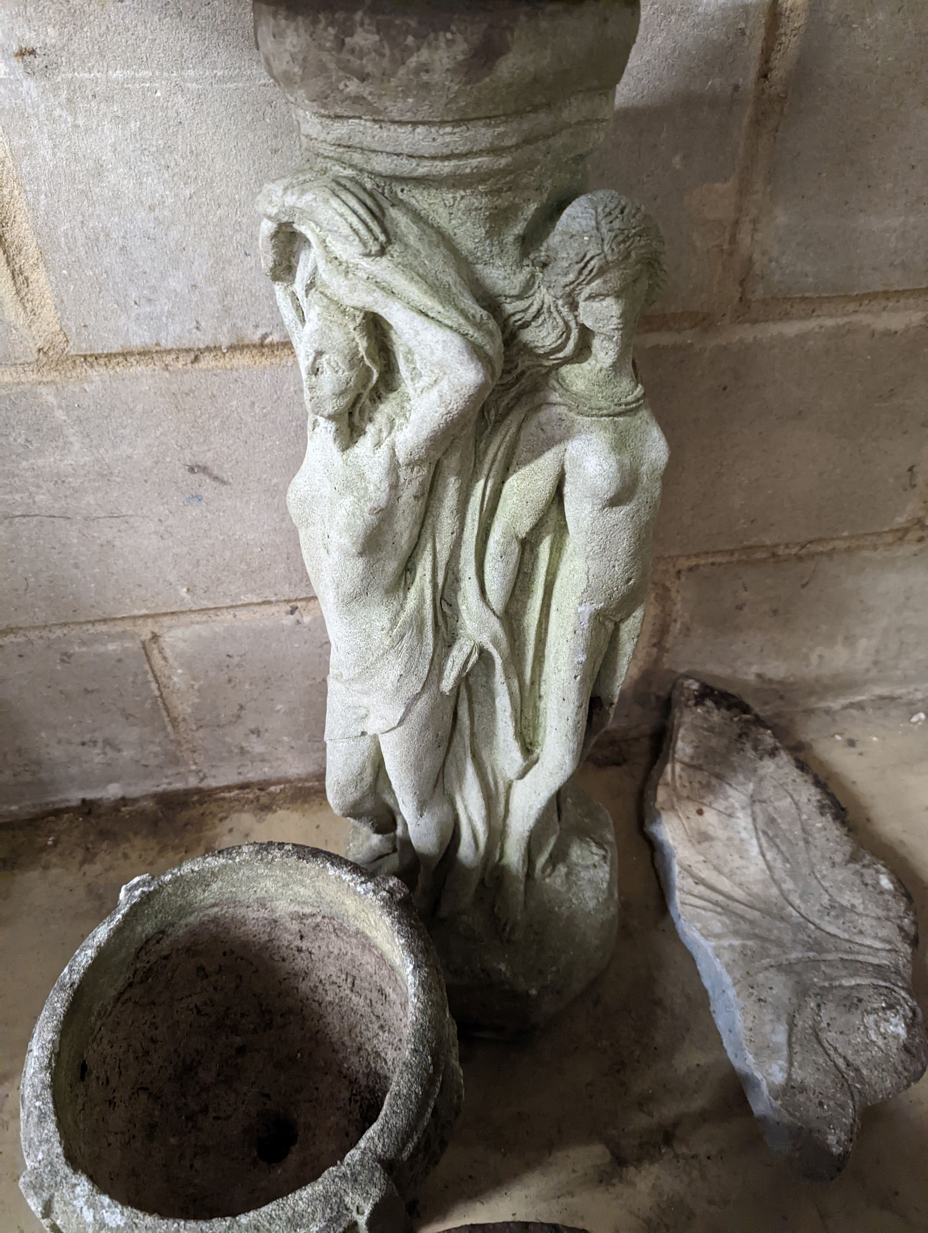 A reconstituted stone bird bath, (damaged) height 80cm together with two circular garden planters
